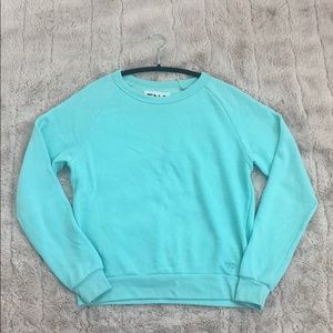 super cute light weight teal TNA sweatshirt